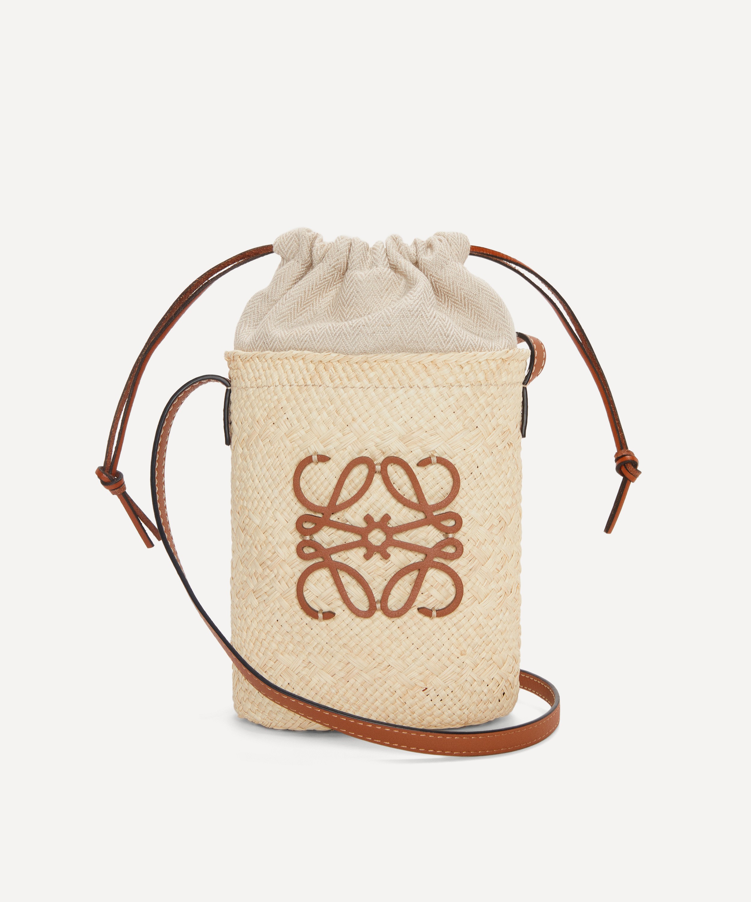 Shop LOEWE Drawstring bucket bag in palm leaf and calfskin