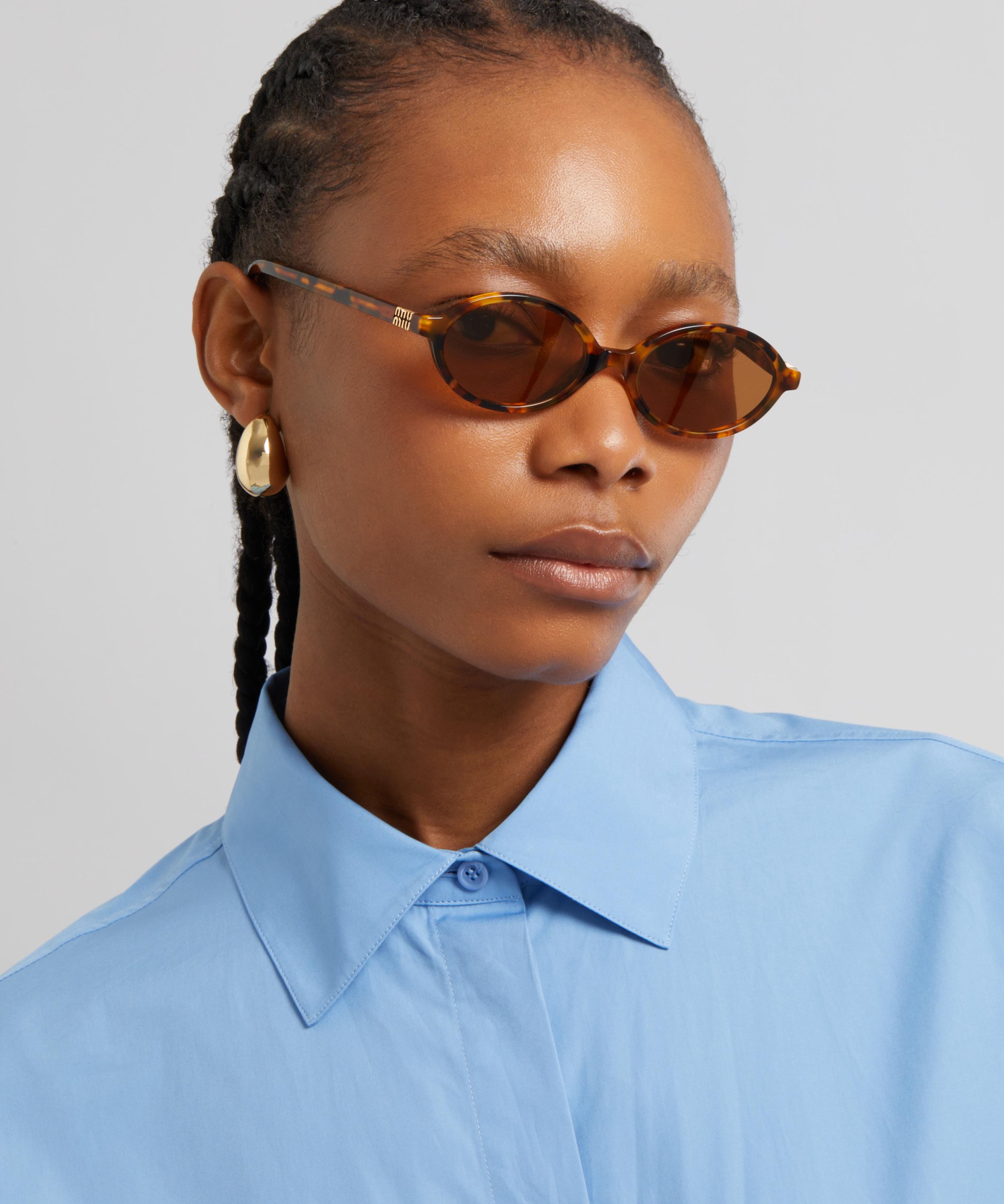 Miu Miu - Oval Sunglasses image number 1