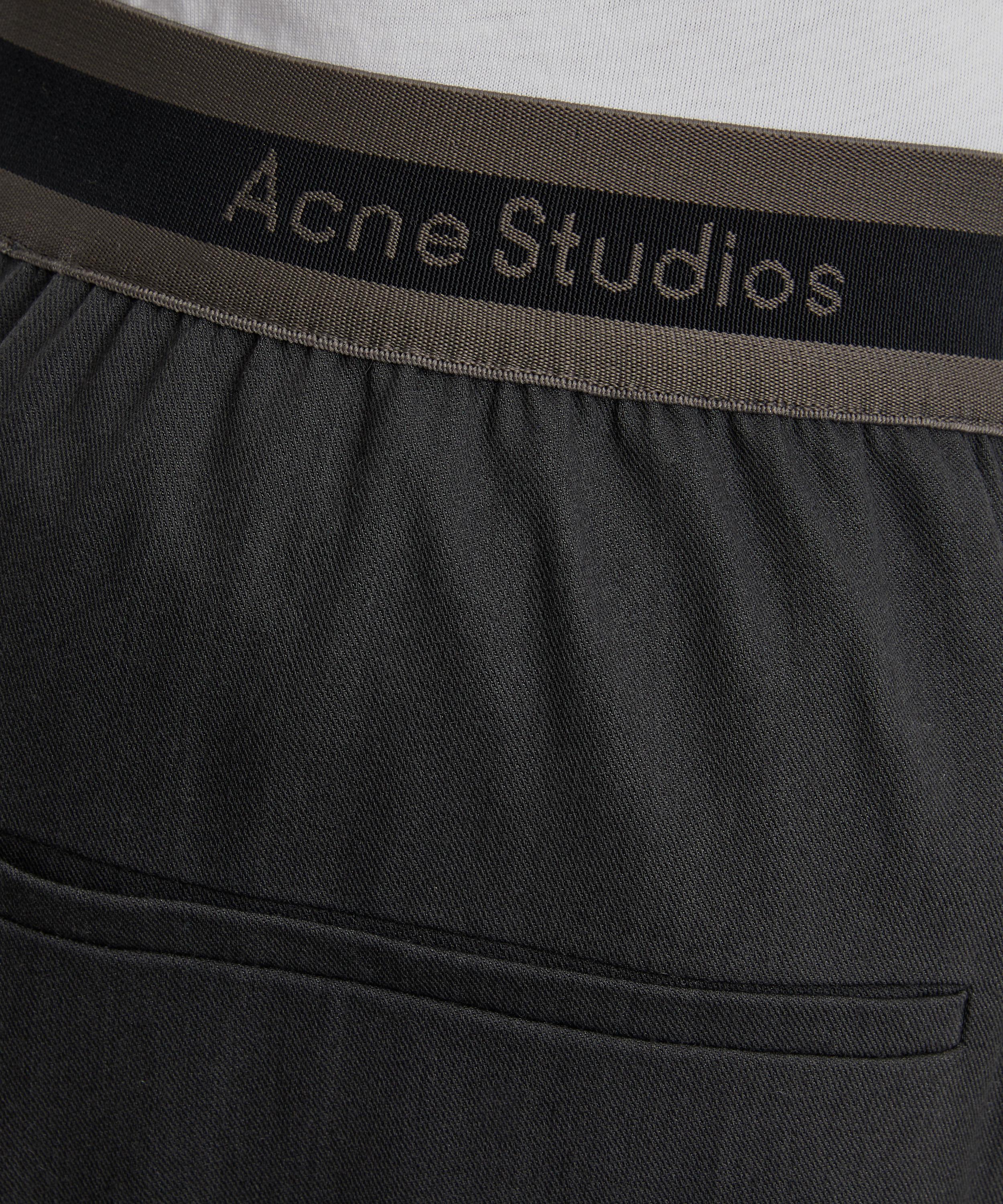 Acne Studios - Logo Tape Trousers image number 4