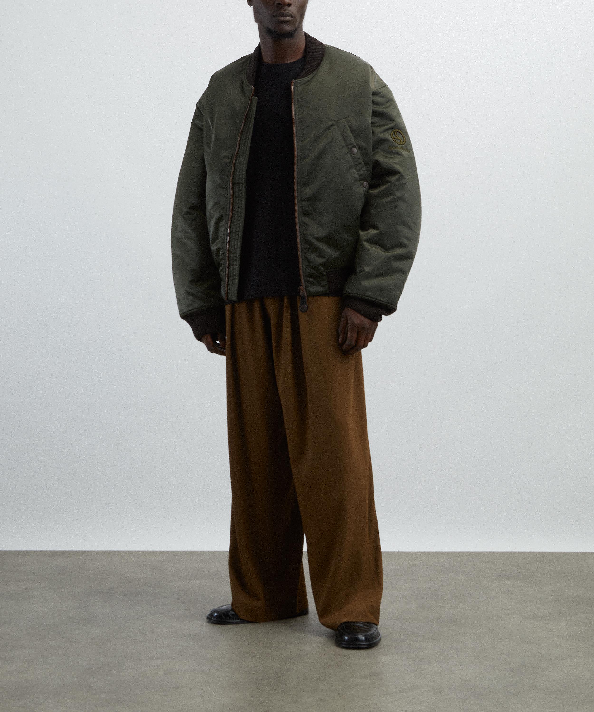 Acne Studios - Brown Loose-Fit Logo Trousers image number 1