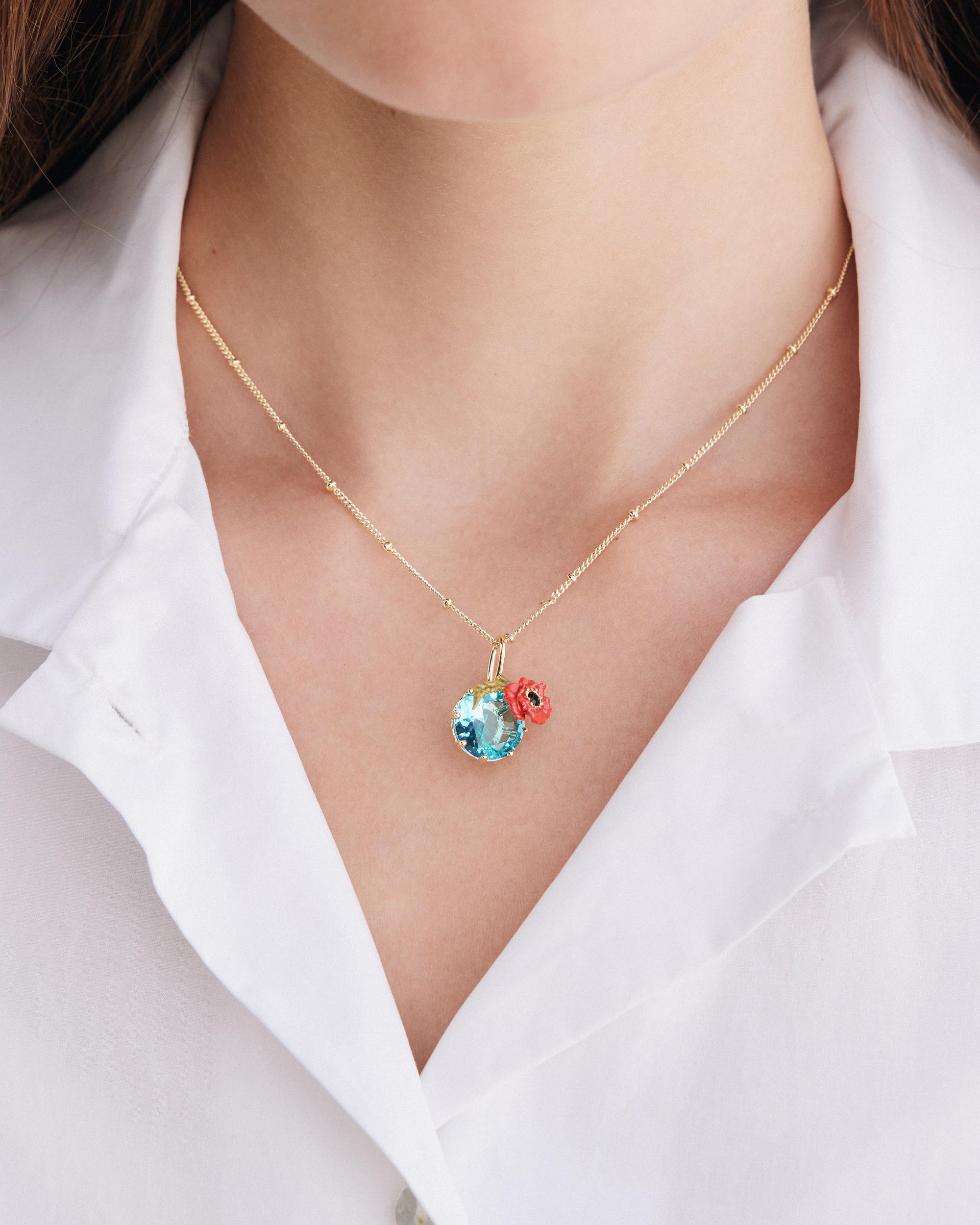 Les N&eacute;r&eacute;ides - Gold-Tone Poppy with Blue Stone Pendant Necklace image number 1
