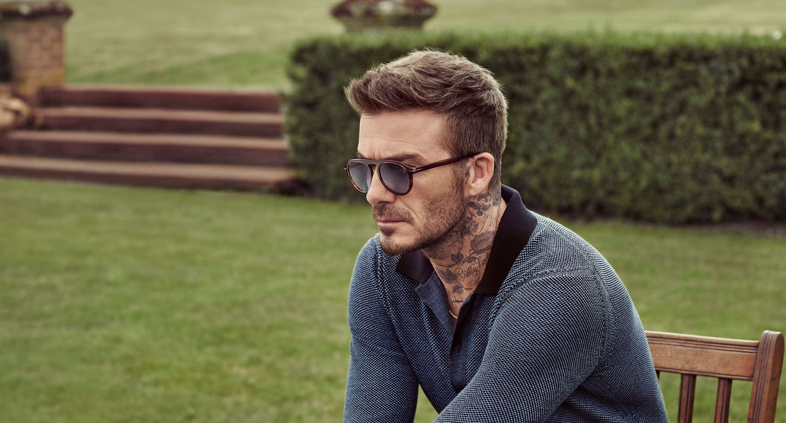 David Beckham accessorises his jeans with a scarf in the back