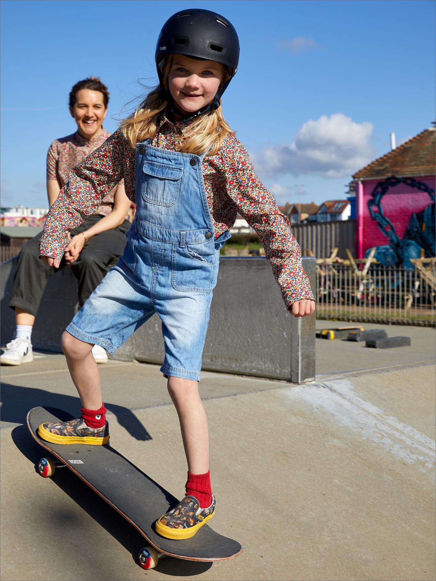 Girl on skateboard in jeans