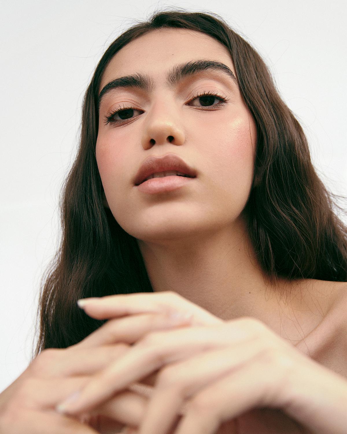 Woman with healthy nails and glowing skin