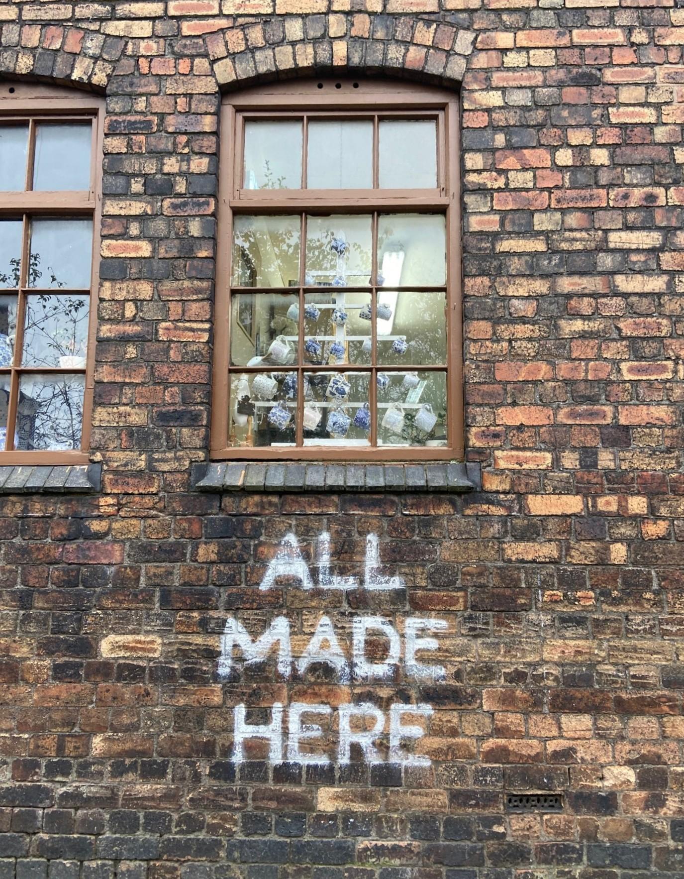 Middleport Pottery's All Made Here Sign on a brick wall