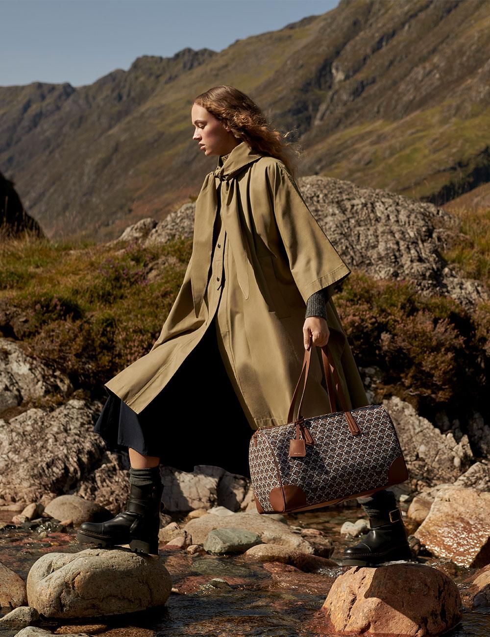 Liberty Iphis Weekender bag with model in Scotland