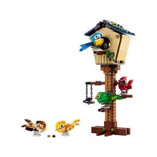 Un Oiseau Lego Se Tient Sur Un Sol Rocheux.