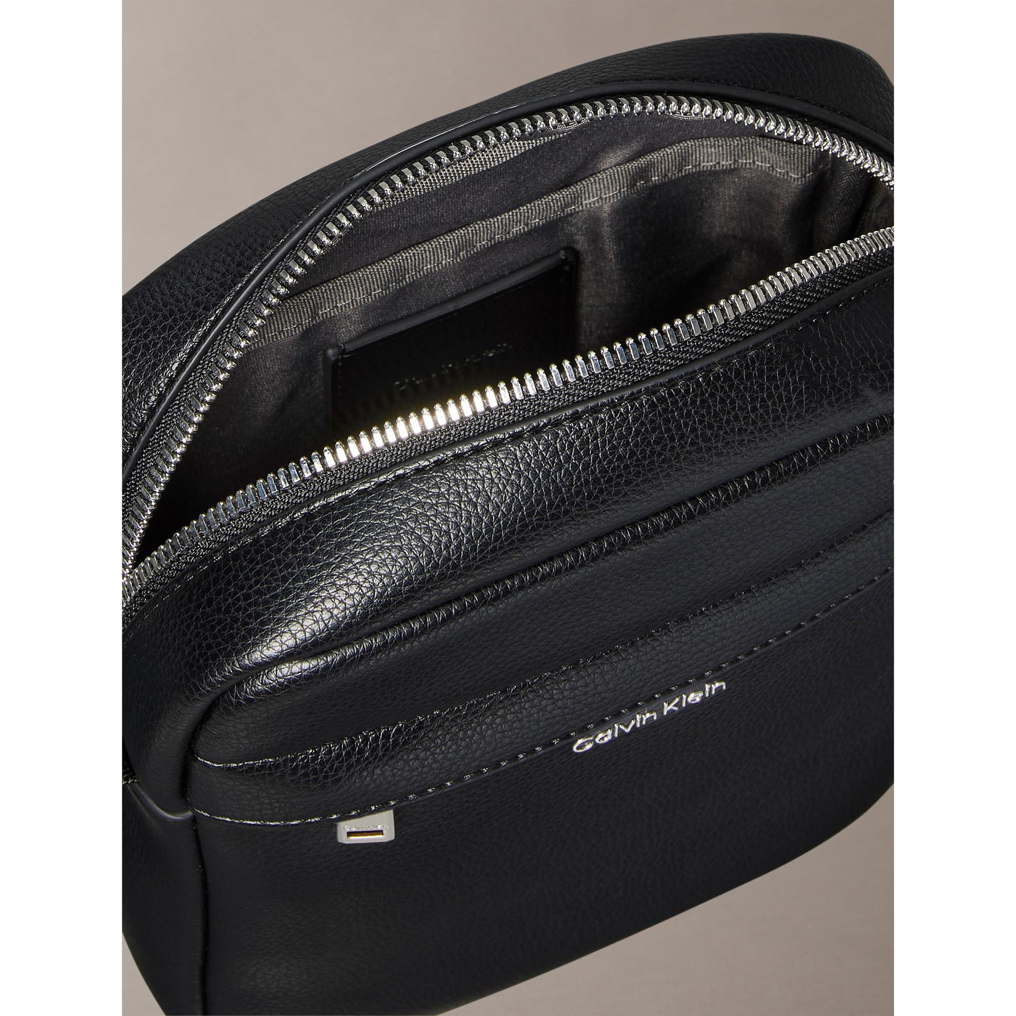 Calvin Klein Jeans Raised Logo Reporter Bag  