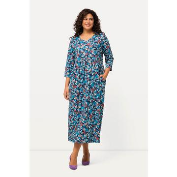 Robe en jersey. Imprimé. Décolleté en V et manches 3/4.