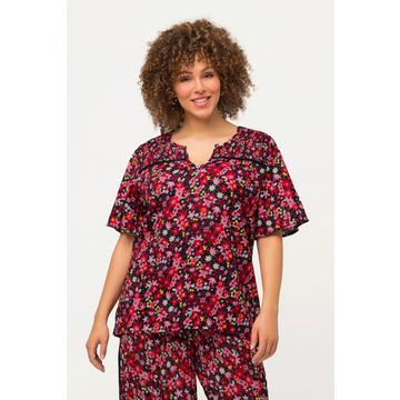 Blouse smockée avec imprimé floral, col tunisien et manches courtes. Ligne en A.