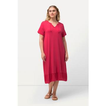 Robe midi en jersey, avec col tunisien et manches courtes. Silhouette en A évasée.