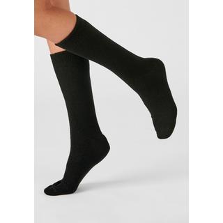 Damart  Chaussettes maille jersey. 