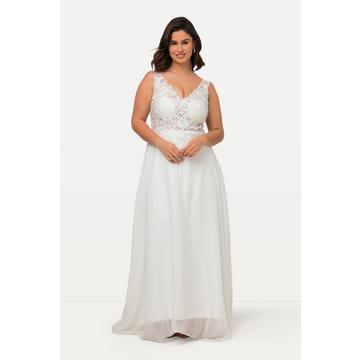 Robe de mariée sans manches. Col en V et traîne. Ligne en A.