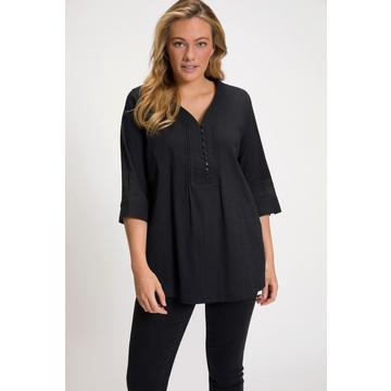 Tunique en tissu gaufré. Manches 3/4