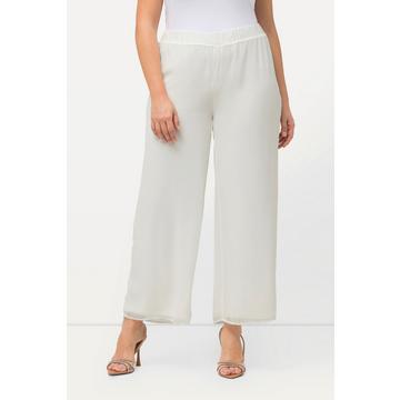 Pantalon double épaisseur, jersey et doublure en mousseline. Jambe large et taille élastique.