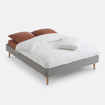 Lit rembourré avec sommier