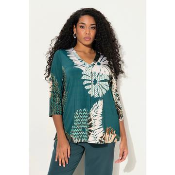 T-shirt au tombé fluide, imprimé à fleurs. Coupe évasée, décolleté en V et manches 3/4.