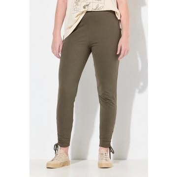 Legging en coton bio. Taille élastique et bas de jambe avec fronces.