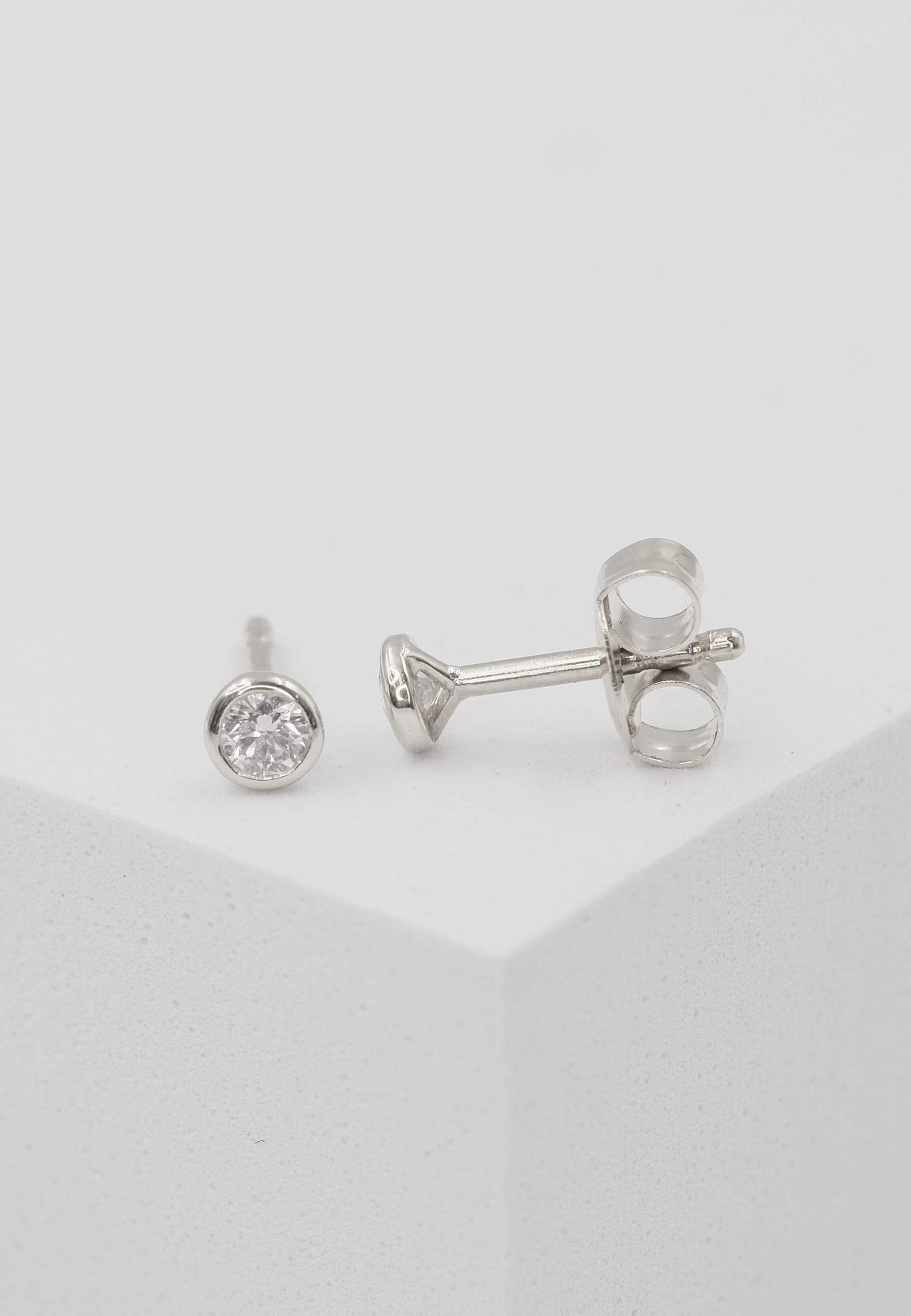 MUAU Schmuck  Clous d'oreilles solitaire monture or blanc 750 diamants 0.16ct. 5mm 