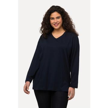 Maglia dalle linee morbide con scollo a V e maniche lunghe