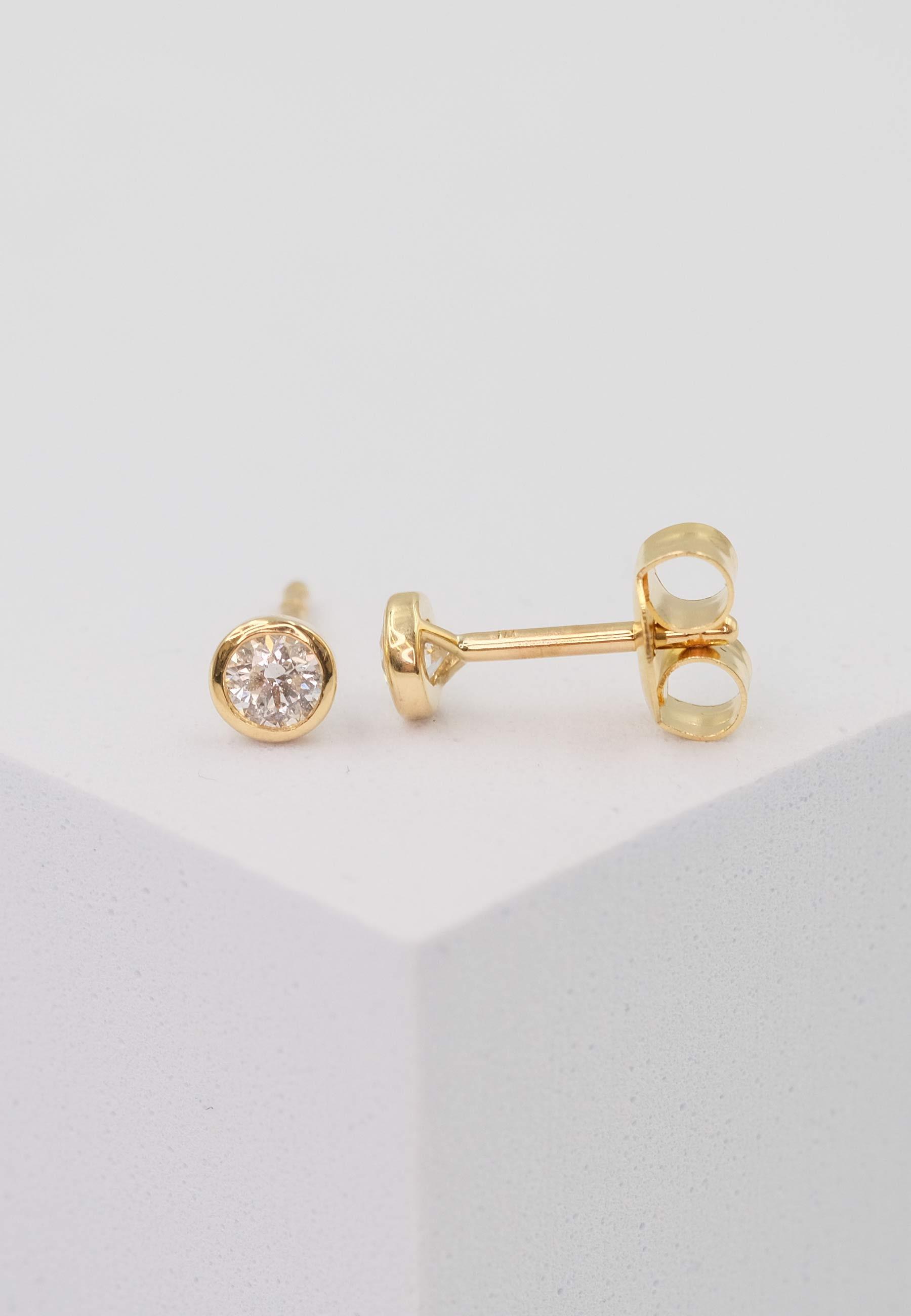 MUAU Schmuck  Clous d'oreilles solitaires monture or jaune 750 diamants 0,25ct. 5,5mm 