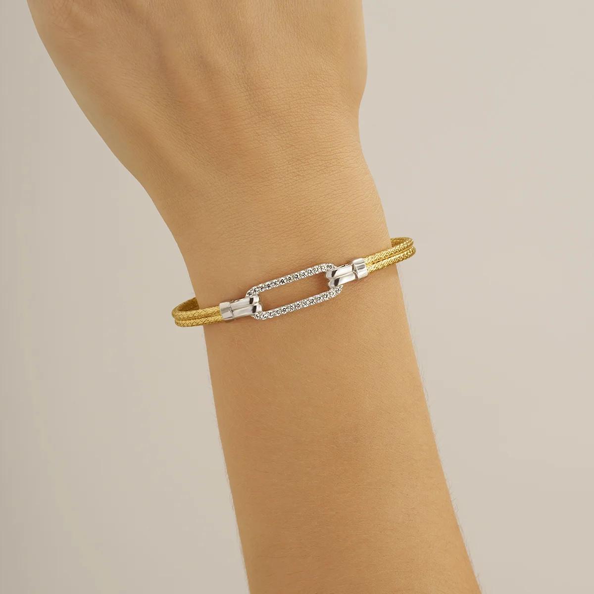 Charles Garnier  Zweifarbiger STYLES-Armreif aus Goldsilber und Zirkoniumoxiden 