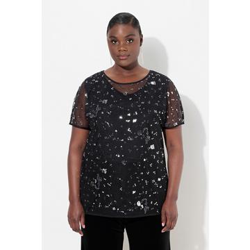 Blouse en mesh. Coupe oversize à manches courtes. Sequins et strass