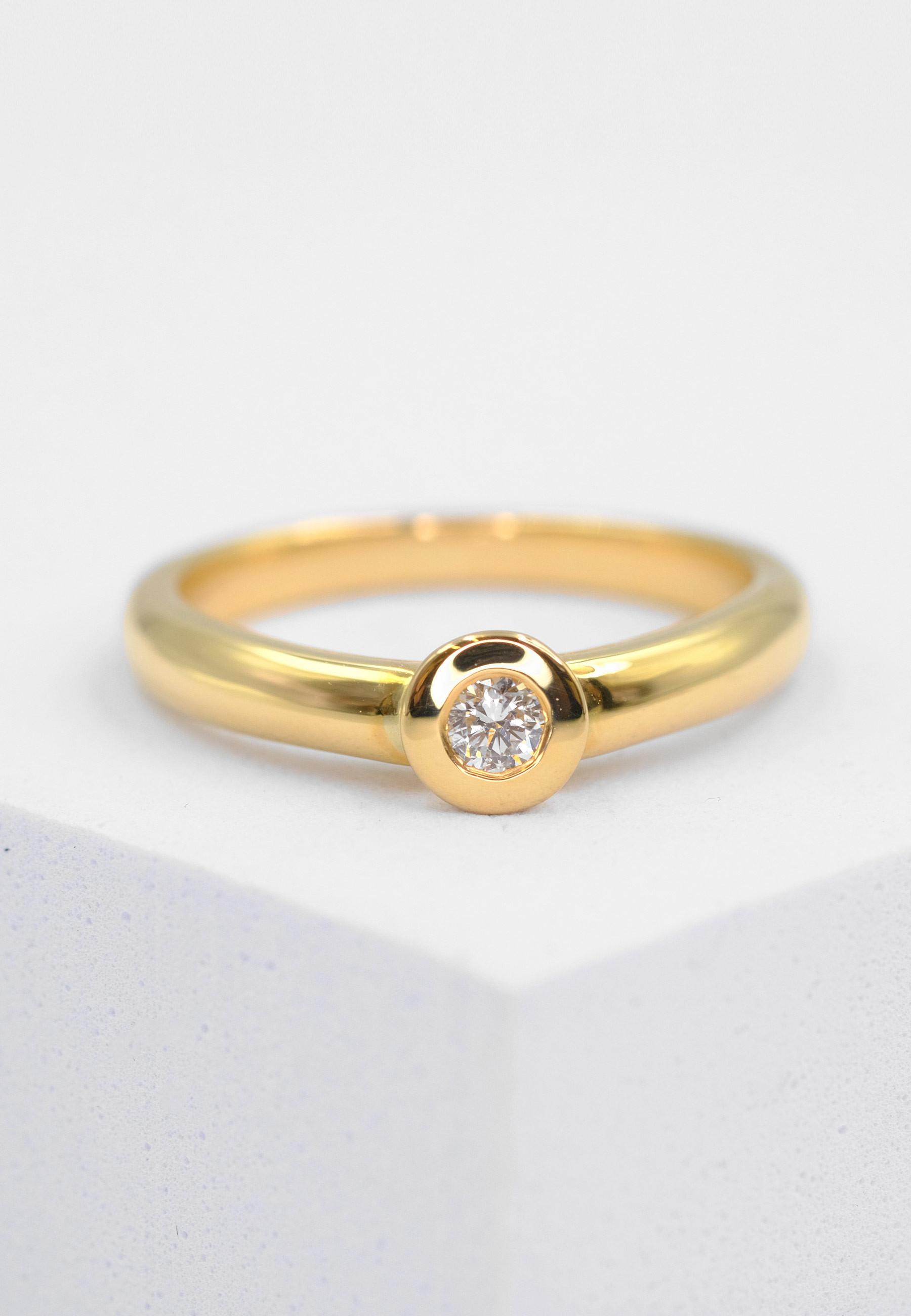 MUAU Schmuck  Solitaire Ring Diamant 0.10ct. Gelbgold 750 