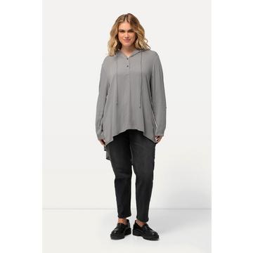 Blouse longue avec capuche. Silhouette en A, plus longue dans le dos. Manches longues.