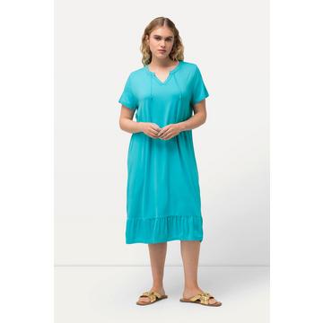 Robe midi en jersey, avec col tunisien et manches courtes. Silhouette en A évasée.