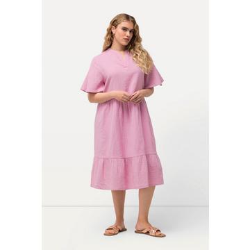 Abito dal taglio svasato in mussola con scollo a tunica e mezze maniche