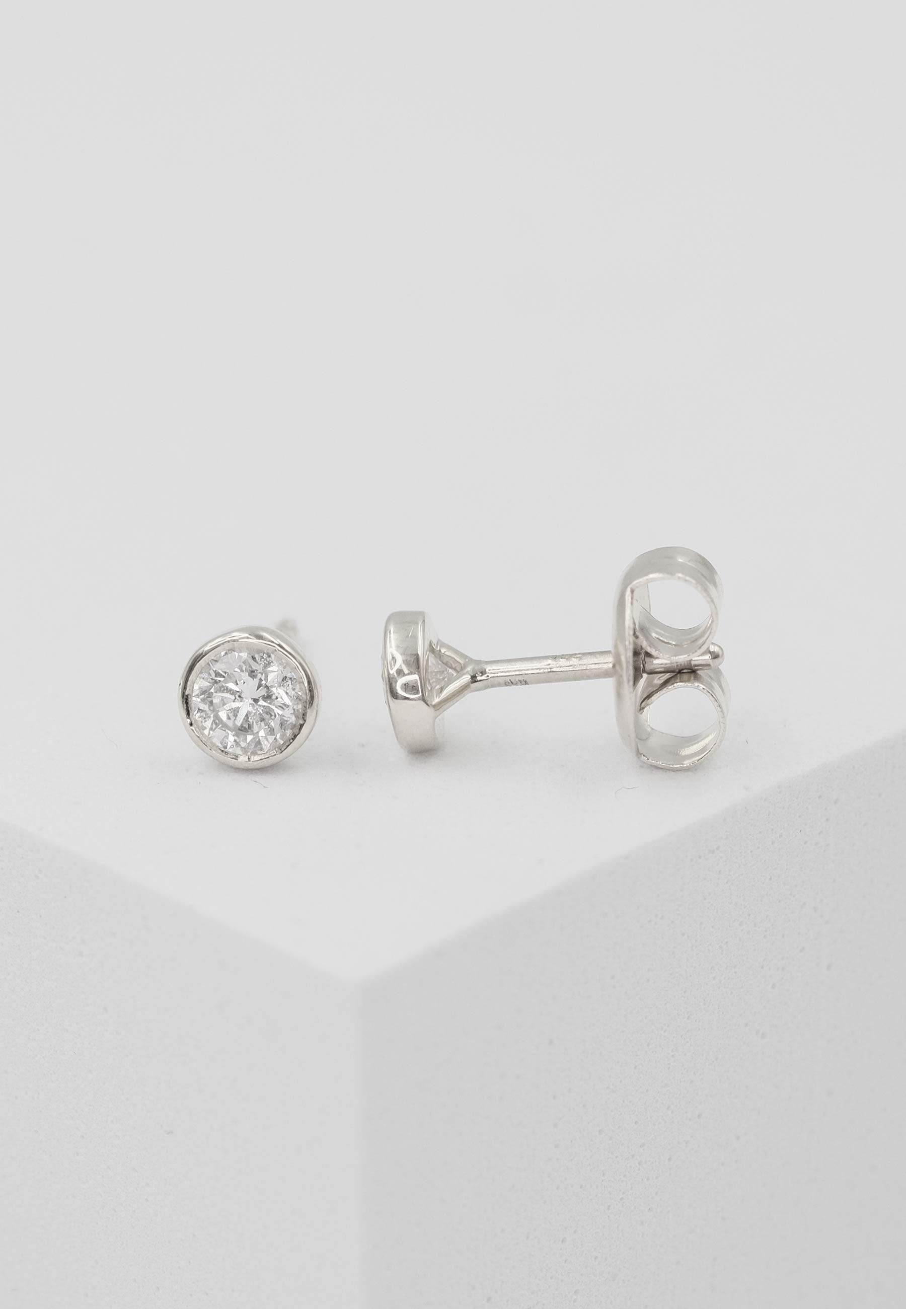 MUAU Schmuck  Clous d'oreilles solitaires monture or blanc 750 diamants 0,50ct. 6,5mm 