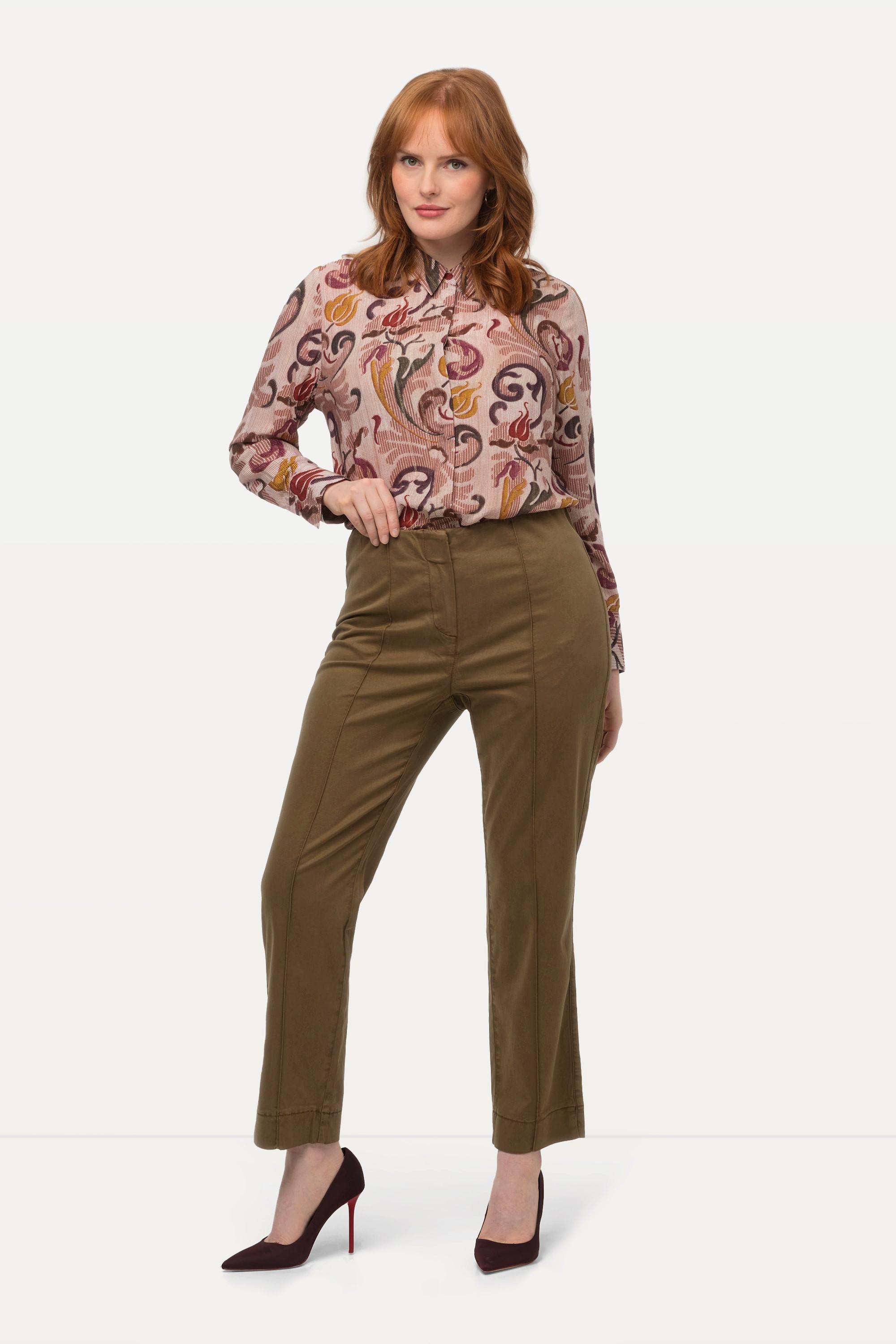 Ulla Popken  Pantalon avec passepoil et taille élastique. Coupe ajustée avec fente sur le bas de jambe. 