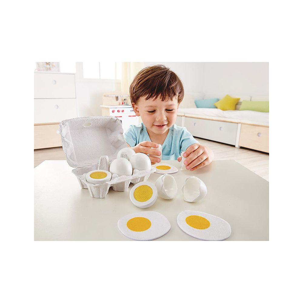 Hape  Eierkarton von | 3 hartgekochte Eier mit leicht ablösbarer Schale & 3 Spiegeleier, Realistisches Lernspielzeug für Kinder ab drei Jahren aus Holz 