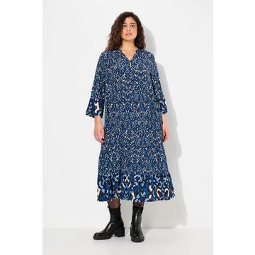 Abito dal taglio svasato con scollo a tunica e maniche a 3/4 con volant