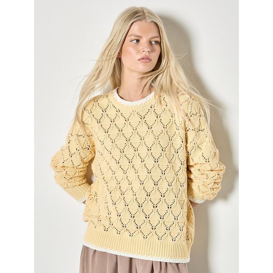 Pull en maille pointelle avec couture festonnée