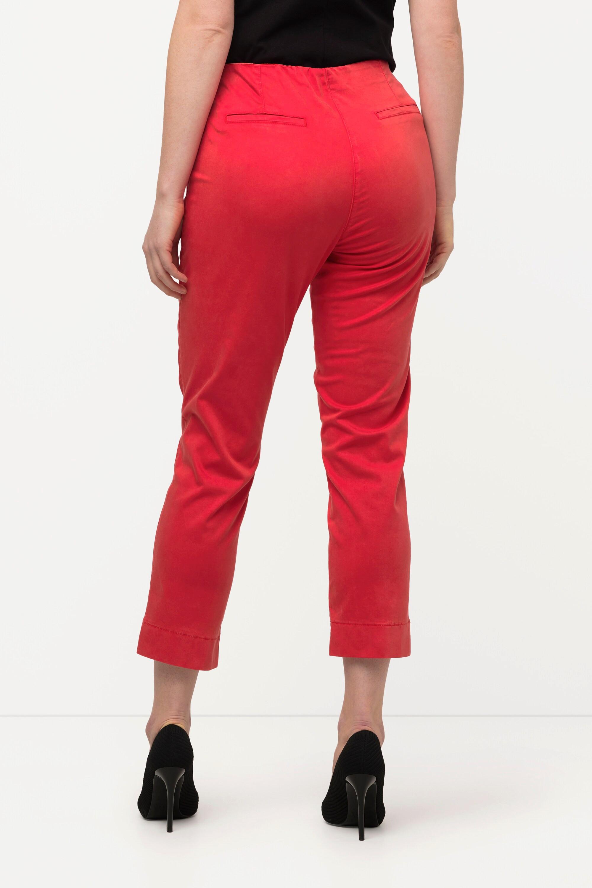 Ulla Popken  Pantalon avec passepoil et taille élastique. Coupe ajustée avec fente sur le bas de jambe. 