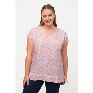 Blouse à fleurs. Décolleté en V, manches courtes. Cordon de serrage à la base.