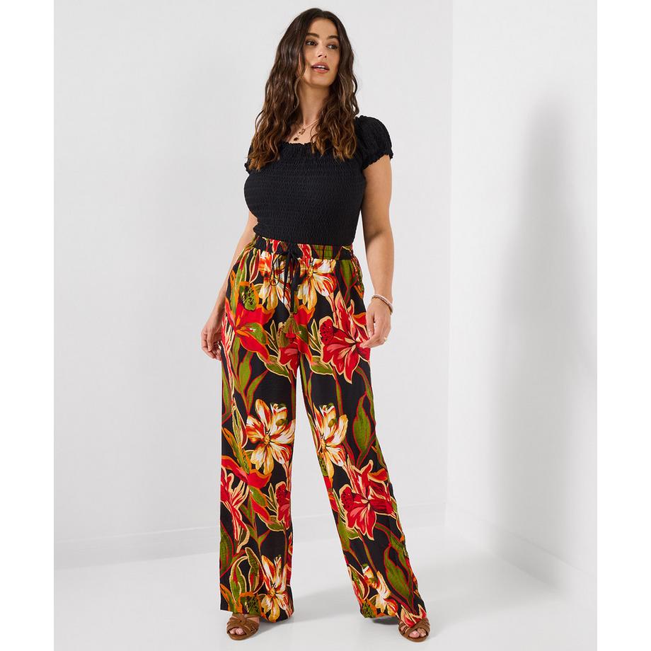 Weit geschnittene Hose mit Blumenmuster und Elastikbund