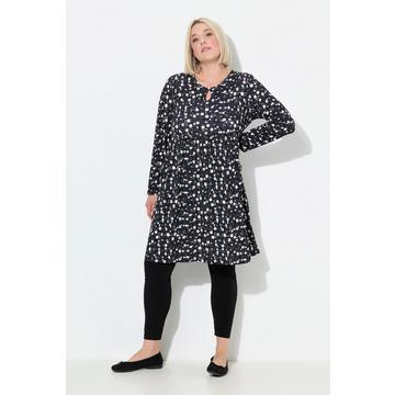 Abito di jersey dal taglio svasato con pallini, scollo a girocollo e maniche lunghe