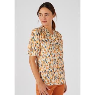 Damart  Geblümte Jacquard-Bluse mit Reliefstruktur, V-Ausschnitt mit Volants, Schulterpasse angerüscht. 