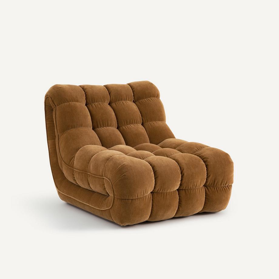 Fauteuil capitonné en velours