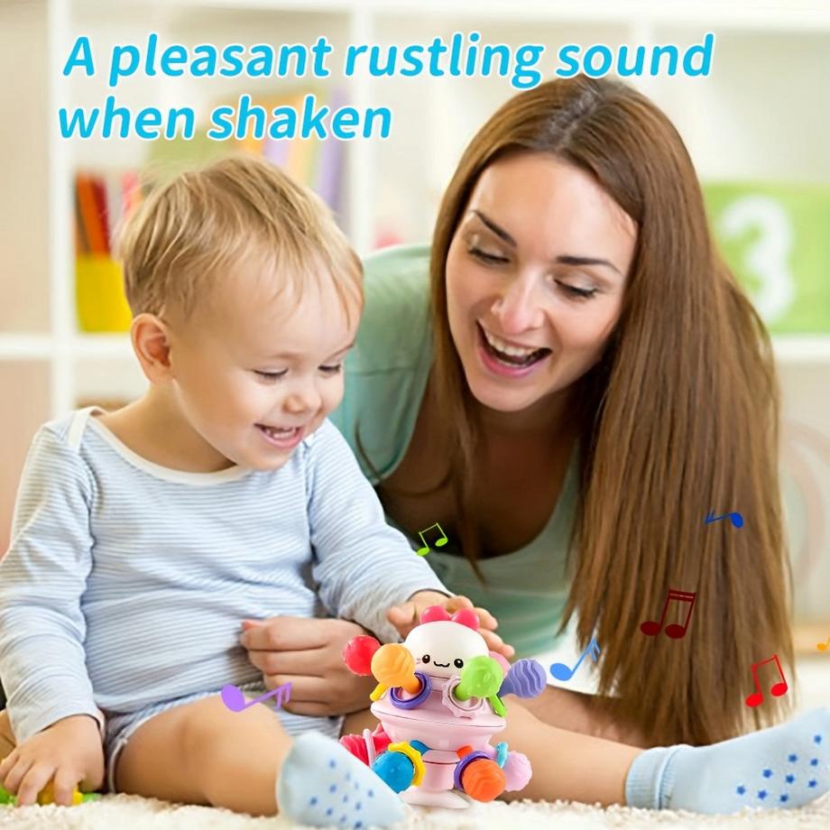 Activity-board  Jouet d'éveil en caoutchouc souple avec clochette, pour la motricité fine et l'éveil sensoriel. 