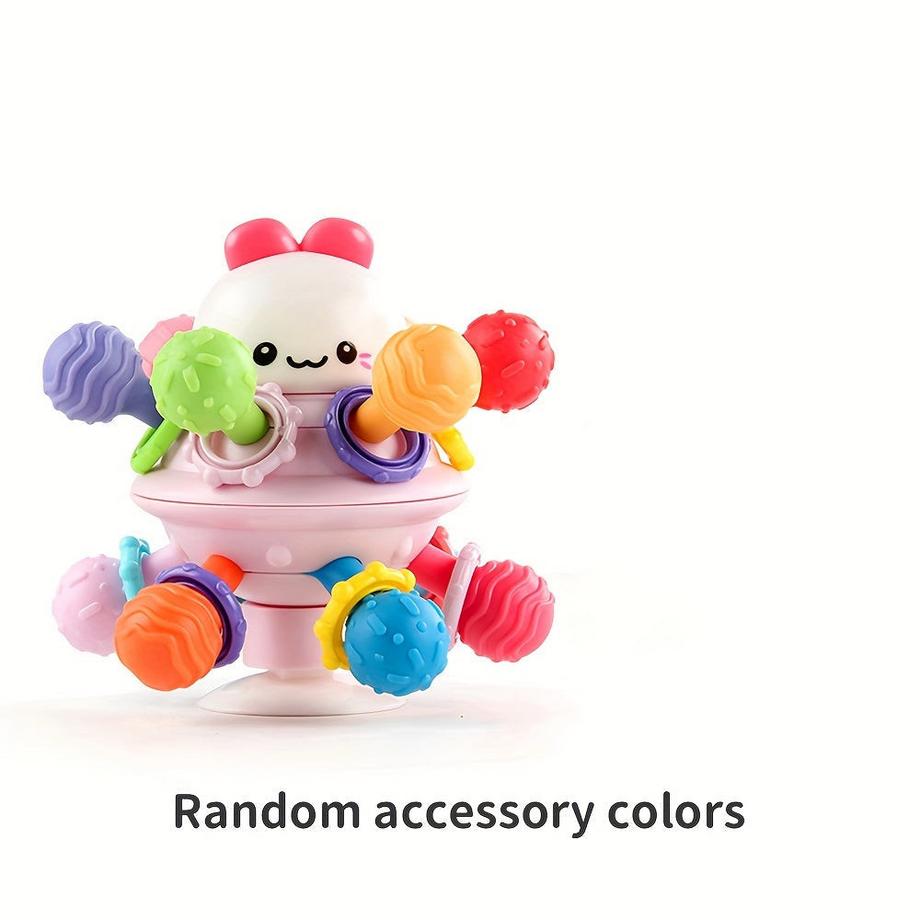 Jouet d'éveil en caoutchouc souple avec clochette, pour la motricité fine et l'éveil sensoriel.