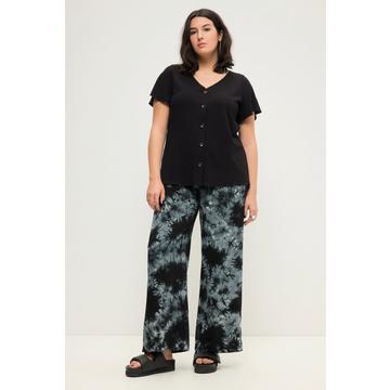 Pantalon taille haute à jambes larges et taille partiellement élastique. Imprimé batik