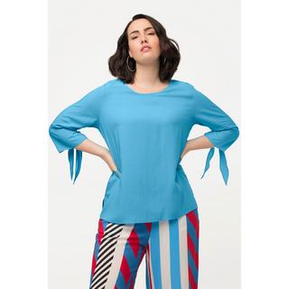 Ulla Popken  Blouse oversize à manches 3/4. Col rond et nœud à la base. 