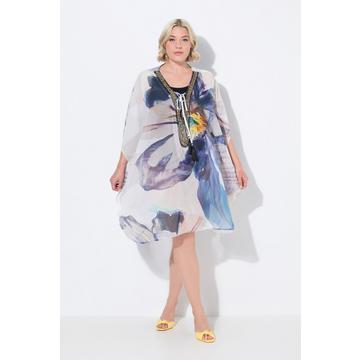 Tunique à fleurs. Décolleté en V et manches courtes. Laçage