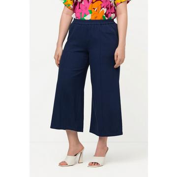 Pantalon 7/8 en lin mélangé. Taille élastique et jambe large.