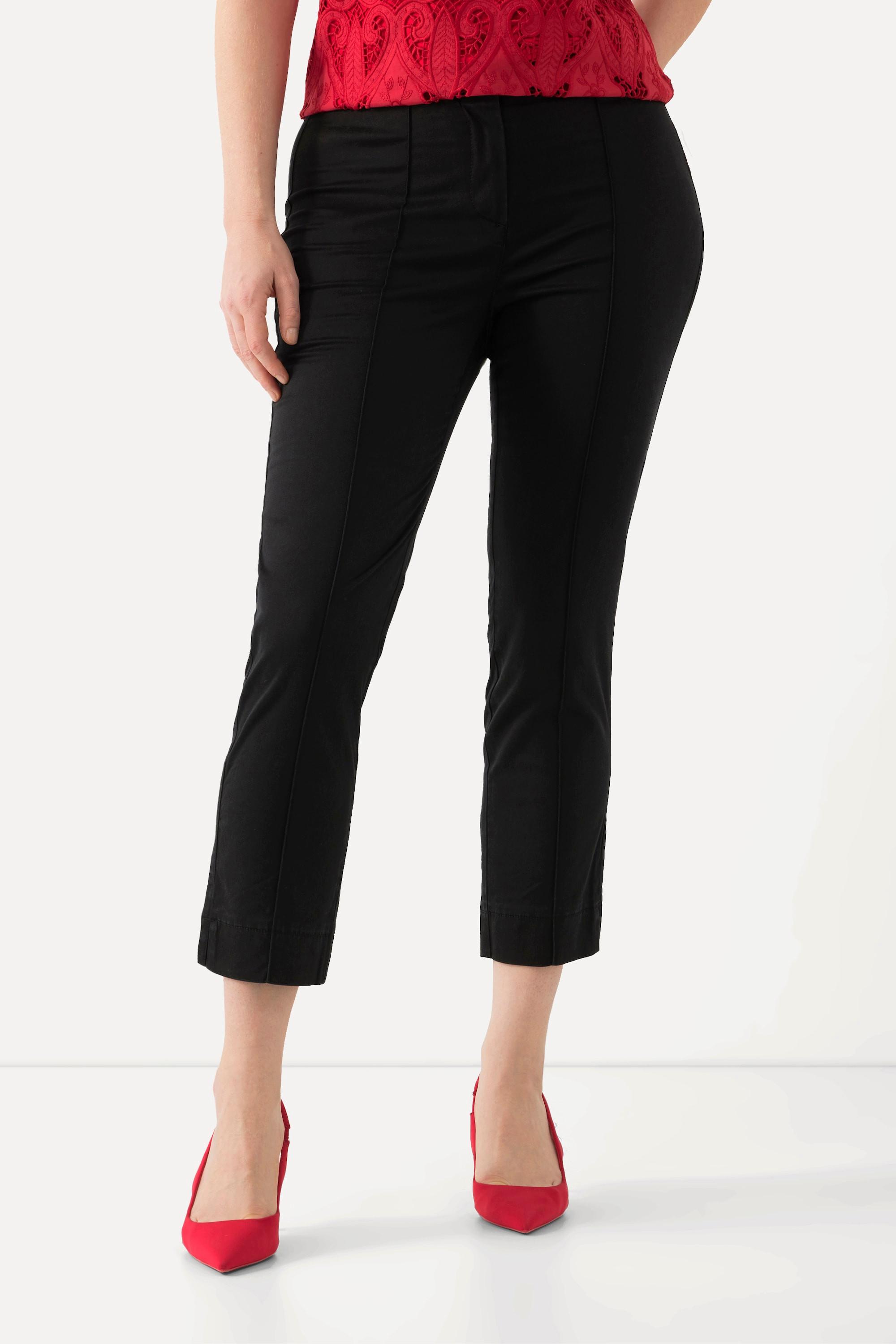 Ulla Popken  Pantalon avec passepoil et taille élastique. Coupe ajustée avec fente sur le bas de jambe. 