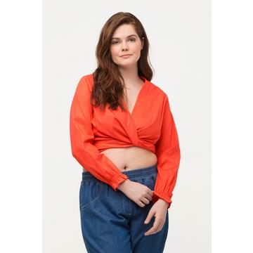 Blouse cache-cœur courte, en coton bio. Avec col en V et manches longues.